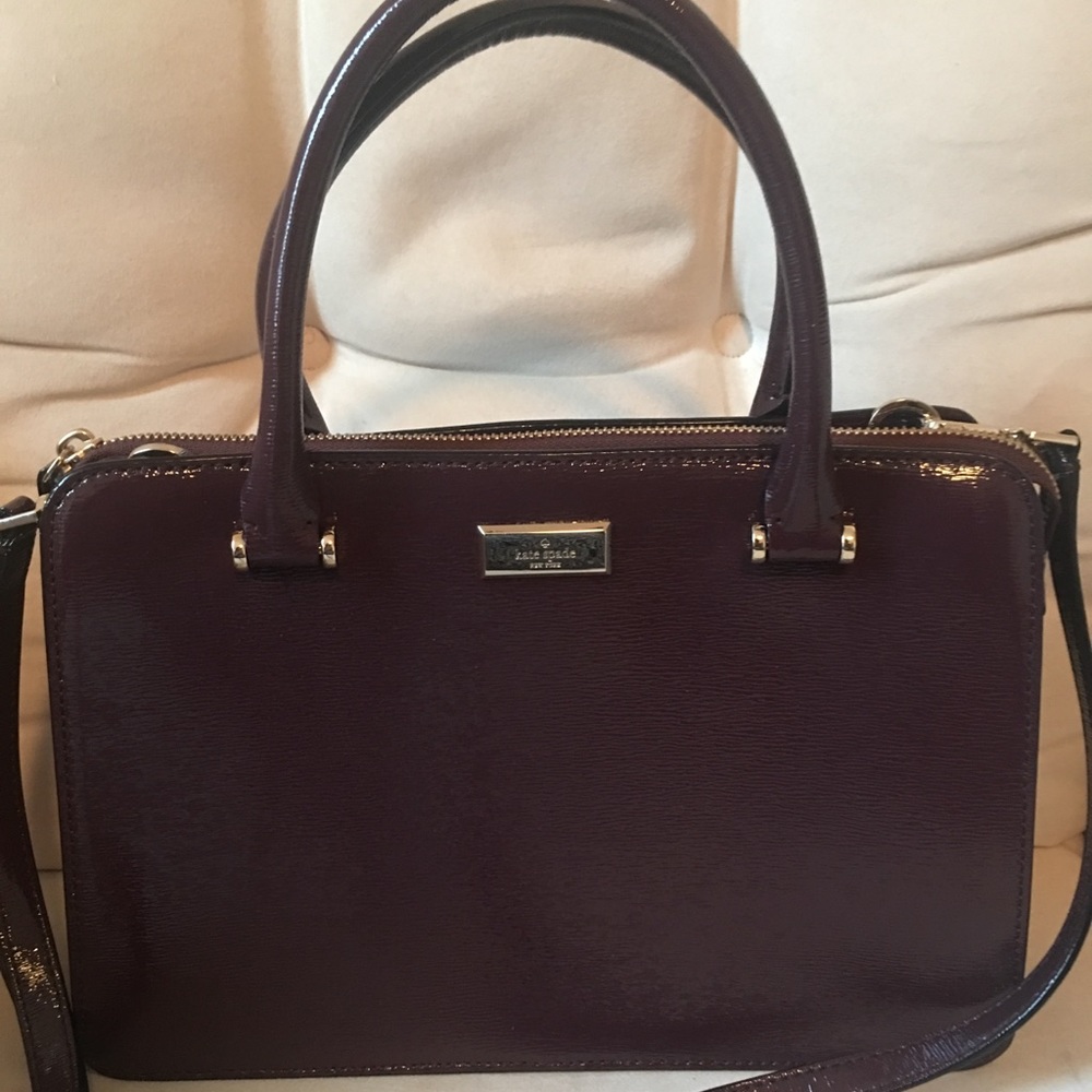 Kate Spade Structured Handbag in burgundy.